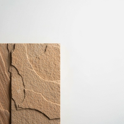 Close-up of a sample of eco-friendly sandstone cladding with a textured surface